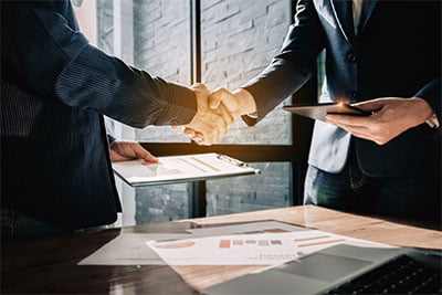 two lawyers shaking hands